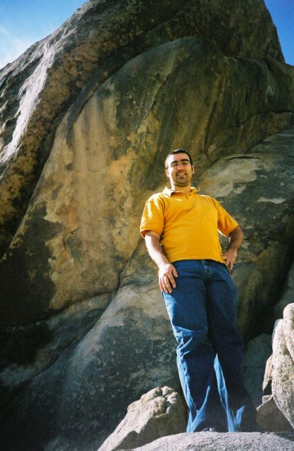 Here he is in front of yet another huge rock (YAHR).